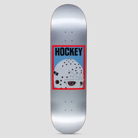 Hockey Half Mask Silver skateboard deck: Red-framed blue panel on a silver deck showing half of a white hockey goalie mask with an eye peering out, with Hockey in black capitals above.
