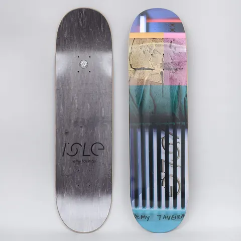 Isle Remy Alpha Process skateboard deck: Both sides shown. The top is a layered photo collage of blocks of carved stone relief, pink and teal panels, and black vertical bars, with the rider's name hand-lettered at the base. The underside is grey with an Isle logo.