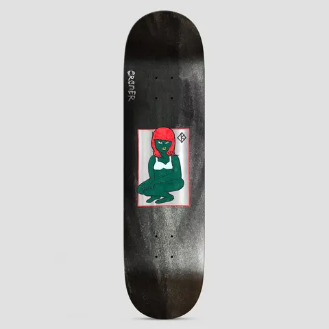 Krooked Cromer The Green Lady DBX Grey skateboard deck: A naive painting of a green-skinned woman with a red bob, in a white bra, crouching inside a framed silver panel on a grey-black stained deck. A small Krooked 'K' mark sits at the top right, with the rider's surname written down the side.