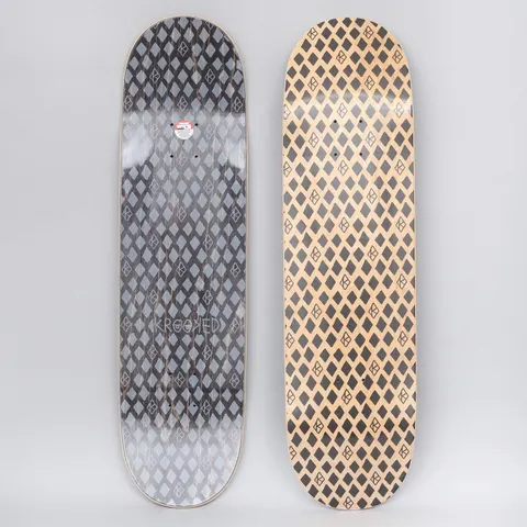 Krooked Dymonds Black skateboard deck: Repeating all-over pattern of black diamond shapes interspersed with small outlined Krooked eye logos on bare natural wood. The underside shows the same pattern in grey on black with a Krooked wordmark.