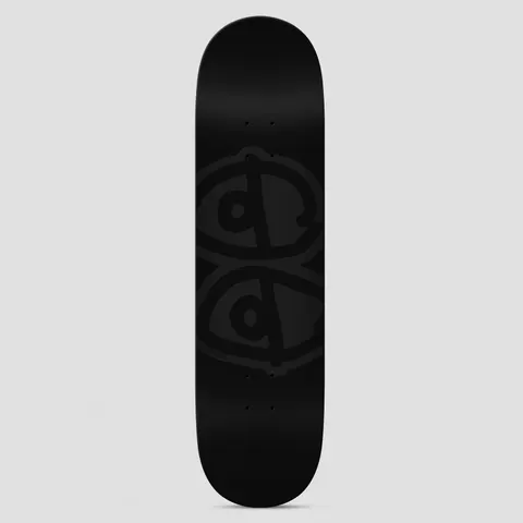 Krooked Eyes Black skateboard deck: A large tone-on-tone black outline of Krooked's scribbled twin 'eyes' logo, stacked vertically, on a plain black deck. A small signature sits near the lower left.