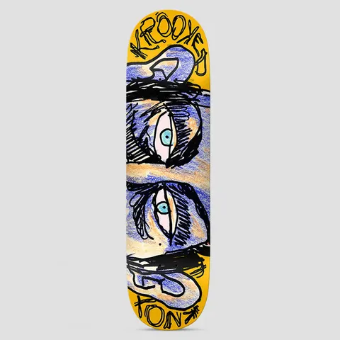 Krooked Knox Watcher Yellow skateboard deck: Crayon-and-ink drawing of a pair of staring blue eyes with heavy black brows and ears, mirrored top and bottom, on a yellow deck. Scrawled Krooked lettering and rider name at the ends.