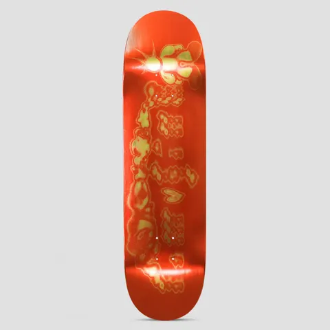 Limosine Nelly Morville Spiker skateboard deck: Metallic red deck with a distorted, blurred gold-green graphic of a cartoon-like character and bubble-style lettering with a heart, with a glinting star at the top.