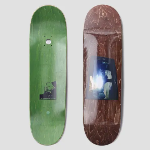 Limosine Cyrus Bennett Window Brown skateboard deck: Brown stained deck with a bluish photographic print of a car window, showing bright light flare and shadowy figures inside. The reverse is green stain with a small black and white portrait and the Limosine name.