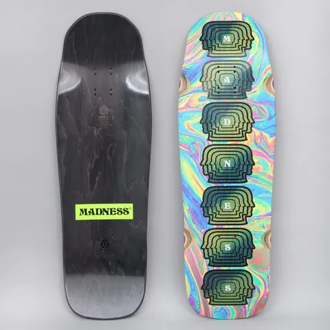 Madness Mental skateboard deck: Old-school shaped deck with a swirling rainbow oil-slick background and a column of seven stacked head silhouettes, each carrying one letter of the brand name. The black underside has a neon yellow Madness label.