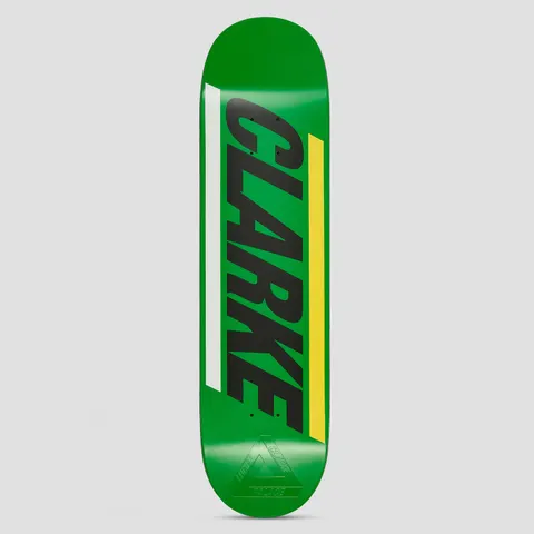 Palace Lucien Pro S43 skateboard deck: Green deck with the rider name CLARKE in large black slanted capitals running along the board, flanked by a white stripe and a yellow stripe. An embossed Palace triangle logo sits near the tail.