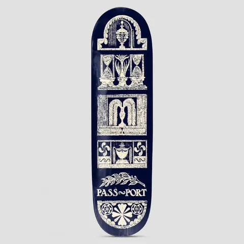 Passport Rubbings Series Court Yard skateboard deck: Cream rubbing-style architectural panels stacked down a navy deck: urns, hourglass-like columns, curtained niches, pinwheels and a floral rosette, with a laurel sprig above the Passport name.