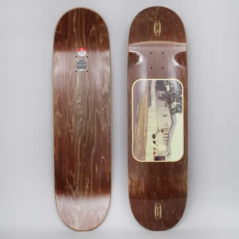 Passport Josh Pall Home skateboard deck: Brown-stained deck with a rounded gold-bordered photo panel of a white wooden house with a tree, and small gold Pass-Port logos at nose and tail. Plain stained underside shown alongside.
