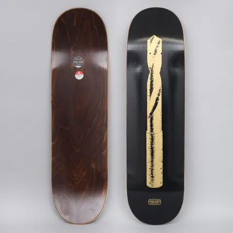 Passport Josh Pall Pro Series Black skateboard deck: A single large gold-coloured twist drill bit, printed in a rough, worn style, running the length of a black deck. A small Pass-Port logo with the rider's name sits at the tail.