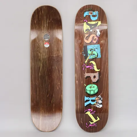 Passport Loot Solid Brown skateboard deck: PASS-PORT spelled vertically in mismatched letter blocks in pastel colours, each decorated with small cartoon figures, tools and objects, over a brown wood-stain deck.