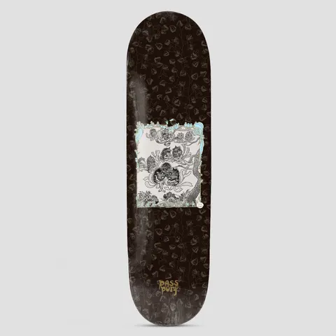Passport x May Gibbs 8.5 Banksia Men skateboard deck: Black deck patterned with faint gold banksia seed pod and leaf outlines, with a central cream panel showing a detailed black ink drawing of small banksia men figures among branches in a pale blue frame. Passport logo at the tail.