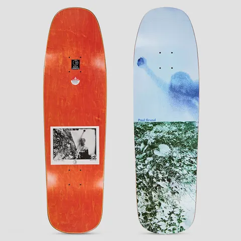 Polar 1992 Paul Grund Man With Window skateboard deck: Shaped deck with a faded blue-toned photo of a figure raising a fist against a pale sky, above a green-tinted photo of foliage. Paul Grund name in blue at the join. Underside shows an orange stain with a small black and white photo.