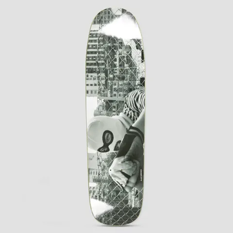 Polar P9 SHAPE Klez Zawisza Hong Kong skateboard deck: Black and white photograph of a person in a balaclava and striped sleeve leaning on a chain-link fence with barbed wire, tall city buildings behind, with white spray marks at both ends. Rider name in tiny type.