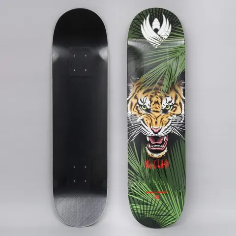 Powell Peralta Peralta 8.25 Brad McClain Tiger Shape 243 Flight skateboard deck: A snarling tiger's face with green eyes looking out from dense green palm fronds, with a white winged emblem at the top. McClain in red lettering sits below the tiger; the underside is plain black.