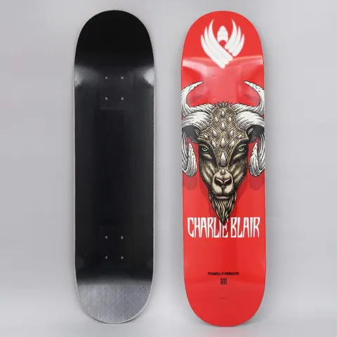Powell Peralta Peralta 8.25 Charlie Blair Goat Shape 243 Flight Red skateboard deck: A detailed illustration of a horned goat's head with green eyes and spiked brow, facing forward on a red deck. A white winged emblem sits at the nose, the rider's name in white capitals beneath. Photo shows top and underside.