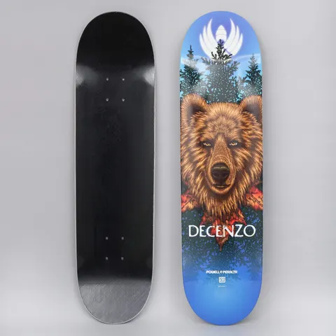 Powell Peralta Peralta 8.25 Scott Decenzo Bear Shape 248 Flight skateboard deck: Detailed illustration of a brown bear's head facing forward among pine trees and red leaves, with a white winged emblem glowing at the top, on a blue gradient. DECENZO in white lettering below.