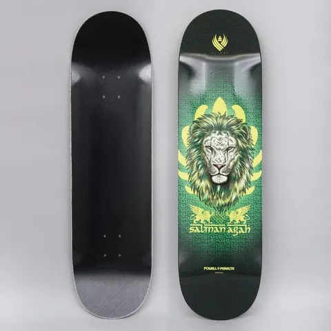 Powell Peralta Peralta 8.75 Salman Agah Lion 2 Shape 245 Flight skateboard deck: A detailed lion's head with a green mane in front of a yellow lotus-like shape and a green maze pattern, with two small winged griffins and the rider name beneath. The underside is plain black.