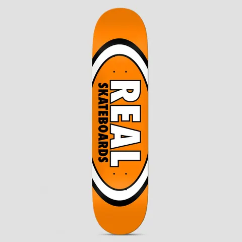 Real Team Classic Oval True Mid Orange skateboard deck: Classic Real oval logo in white and black bands on a bright orange deck, with REAL in large white block letters and SKATEBOARDS in black beside it.