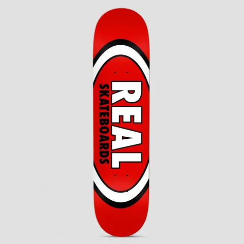 Real Team Classic Oval Red skateboard deck: Red deck with the Real classic oval logo in white and black, with REAL SKATEBOARDS lettering inside the oval.