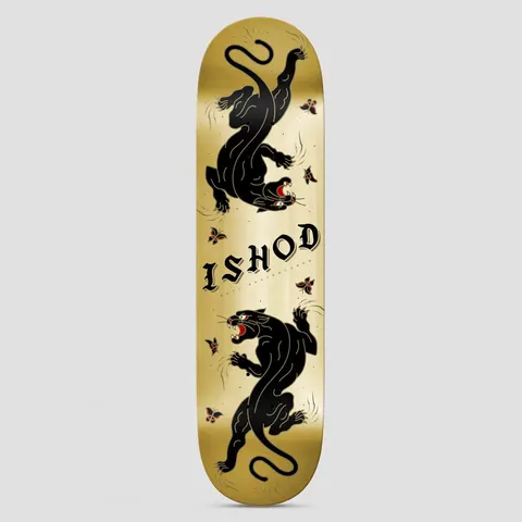 Real Cat Scratch Ishod TT DBX Gold skateboard deck: Two black panthers in traditional tattoo style, one upside down, face each other on a metallic gold deck, with small red-and-black butterflies. Ishod is lettered in black gothic type in the centre.