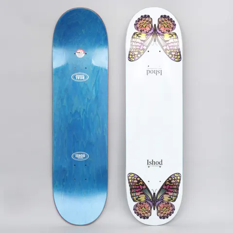 Real Ishod Monarch TT White skateboard deck: White deck with a pair of colourful monarch butterflies in pink, yellow and purple, one at each end, with 'Ishod' in small serif type between them. The photo also shows the blue-stained underside.