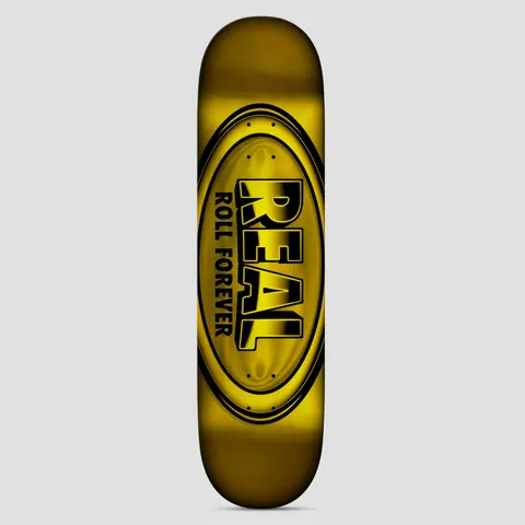 Real DBX Team Oval Yellow skateboard deck: Large oval Real logo with 'ROLL FOREVER' beneath it, printed in black over a glossy metallic gold foil finish.