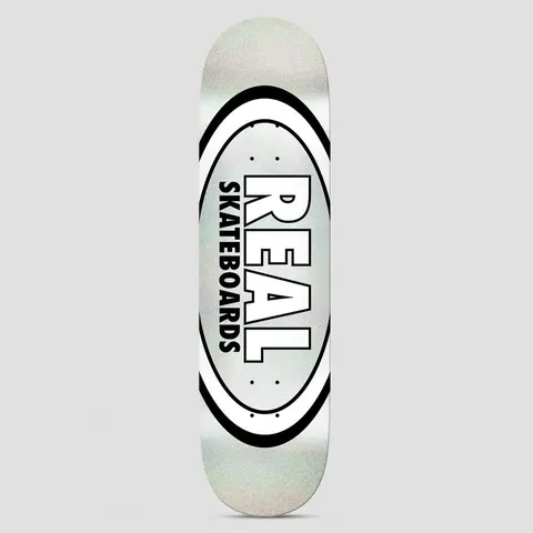 Real Team Classic Oval Easy Rider Silver Holo skateboard deck: Real's classic oval logo with a white and black double ring around a pale silver holographic centre. Large white 'REAL' with black outline sits above vertical 'SKATEBOARDS'.