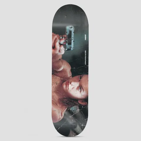 Sci-Fi Fantasy Arin Evil Multi skateboard deck: Weathered, cracked-looking photograph of a woman with her arm raised, pointing a handgun, in a moody teal and skin-tone palette. Small white text runs down the side.