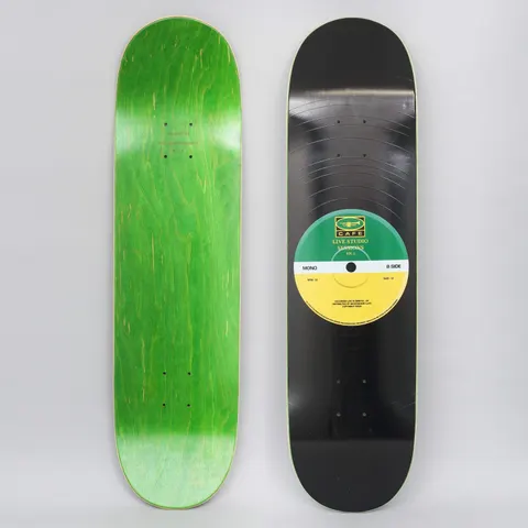 Skateboard Cafe 45 Green / Yellow skateboard deck: A black vinyl record with fine grooves covers the deck, with a green and yellow centre label reading 'Live Studio Sessions Vol. 1' and 'Mono B Side'. The underside is shown in green stain.