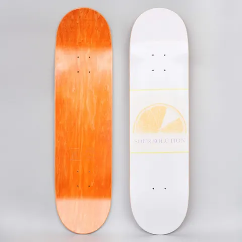 Sour Citrus Grape White skateboard deck: Faded yellow half-slice of citrus fruit between thin yellow lines on a white deck, with SOUR SOLUTION in small lilac serif text beneath. Orange underside shown alongside.