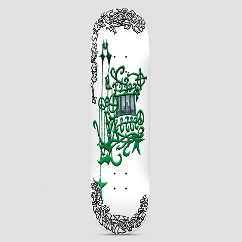 There Marie De Courey Magic Lies In The Healing White skateboard deck: Ornate green gothic-style calligraphic lettering with chains and stars around a small purple framed image of a seated figure, with black scribbled border lettering at the corners, on white.