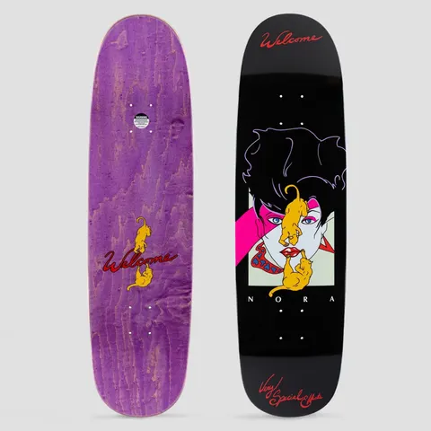 Welcome Special Effects Nora Pro Model on Sphynx Black skateboard deck: A retro 1980s-style illustration of a woman with black hair, pink eye make-up and red lips, with two golden cats climbing over her face, on black. Red script lettering at nose and tail; the underside is shown in purple stain.