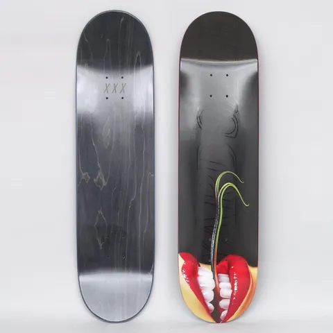 Yardsale Sedusa Black skateboard deck: Close-up photograph of red-lipped mouth with white teeth at the tail, a green plant shoot growing up from between the teeth, on a black deck with faint outlined lettering. Underside is black with XXX marks.