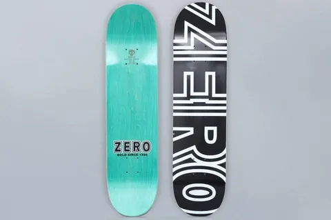 Zero Zero 7.75 Bold Black / White skateboard deck: Large white outlined 'Zero' block lettering running vertically down a black deck. The teal-stained underside shows a small 'Zero Bold since 1996' logo.