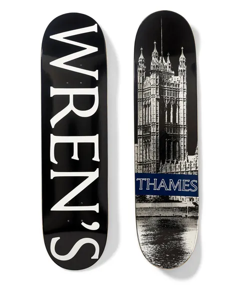 Thames MMXX Wrens Board skateboard deck: Two decks. One is black with huge white serif 'WREN'S' running down its length. The other is a black and white photo of a Gothic Revival tower beside a river, with a navy band reading THAMES across the lower part.