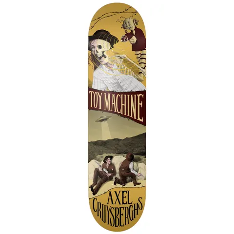 Toy Machine Axel Cruysberghs Horror Show 8.50 skateboard deck: Western-themed collage in sepia tones: a skeleton in a cowboy hat and shirt above a toy-like doll creature, a maroon banner with the brand name, then two gunslingers hiding behind sacks as a UFO hovers over desert hills.