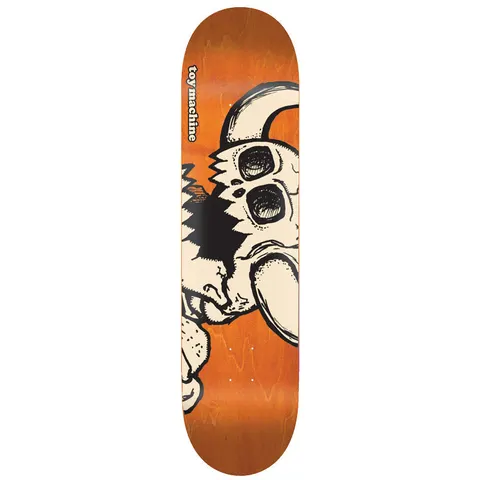 Toy Machine Dead Monster 7.50 skateboard deck: A large cream horned monster skull with a broken, torn-away section and hollow eyes sits on the right of an orange-stained deck. The brand name runs vertically in white lettering inside a black outline on the left.