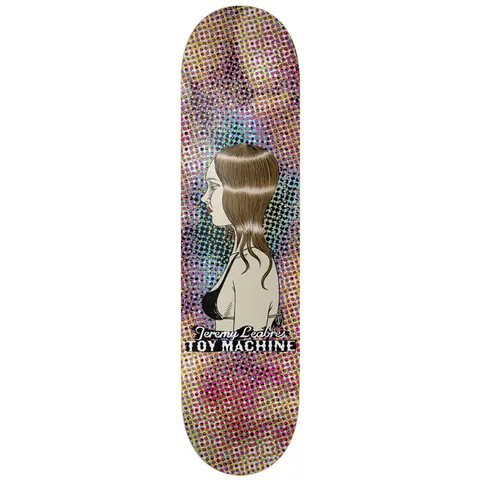 Toy Machine Jeremy Leabres Profile 8.38 skateboard deck: Side-profile illustration of a brown-haired woman in a black bikini top, set against a multicoloured halftone dot background, with the name and Toy Machine in lettering below.