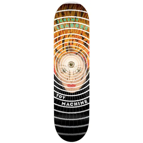 Toy Machine Jeremy Leabres Third Eye 8.25 skateboard deck: Concentric rings radiate from a woman's face with a third eye on her forehead, with flame-like orange hair at the top and black and grey rings below. Rider name in green at the top.