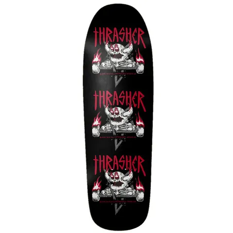 Toy Machine X Thrasher Monster - Gram 9.50 skateboard deck: The Thrasher magazine logo in red above a horned Toy Machine monster skull with flaming wheels and crossed bones, repeated three times down a black shaped deck. Small red text runs under each skull.