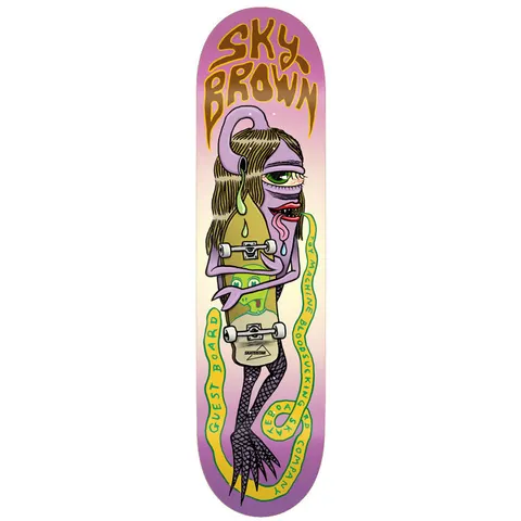 Toy Machine Sky Brown Guest Board 8.25 skateboard deck: A purple one-eyed long-haired creature with a lolling tongue clutches a skateboard that has a green face on it, with a yellow snake looping around it carrying lettering. The rider name is in wobbly brown lettering at the top on a pink and cream fade.