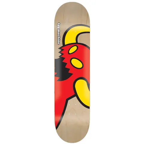 Toy Machine Vice Monster Natural 8.38 skateboard deck: Close-up, cropped cartoon monster in red with yellow eyes, a yellow horn and arm, and a jagged black bite mark, on a natural wood-stained deck. The brand name is printed vertically in white at the top left.