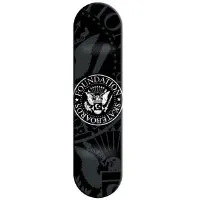 Foundation Seal Decks skateboard deck: Foundation Skateboards circular seal in the style of a presidential crest, with an eagle and shield, on black with faint grey eagle and ornamental shapes behind.