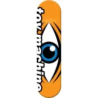 Toy Machine Sect Eye skateboard deck: Large cartoon eye with blue iris and white highlight, set between dark lashes, on an orange deck. 'toymachine' in bold white lettering runs vertically down the left edge.