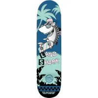 Foundation Cheapo Land Shark skateboard deck: A cartoon shark in a cap and sunglasses rides a pastel skateboard on land among palm trees. Ransom-note style letters spell the title, with a checkerboard band and palm silhouettes below.