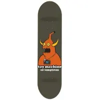 Toy Machine Templeton Monster skateboard deck: Orange horned monster with yellow eyes and a camera around its neck on a dark olive-grey deck, with the toy machine and ed templeton name below in white lettering.