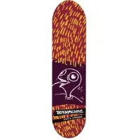 Toy Machine Stephens Turtle skateboard deck: Maroon deck covered in yellow-orange dashes, with a dark purple panel in the middle holding a white line drawing of a bird-like turtle head with a large eye. Brand and rider name sit in a black strip near the tail.