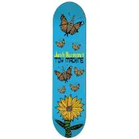 Toy Machine Harmony Neofolk skateboard deck: Bright blue deck with monarch butterflies rising above a large yellow sunflower with green leaves at the tail. Yellow and black lettering across the middle gives the rider and brand name.