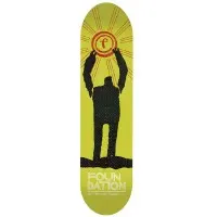 Foundation Nguyen Heroes Fiberlam skateboard deck: Black silhouette of a figure with raised arms holding up a Foundation 'f' emblem like a sun with orange rays, on a lime green background. Foundation lettering at the base.