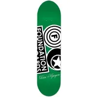 Foundation Nguyen Questionable skateboard deck: Green deck with the large black and white Foundation logo, a tilted wordmark box beside concentric-circle F and star emblems, and a script signature near the bottom.